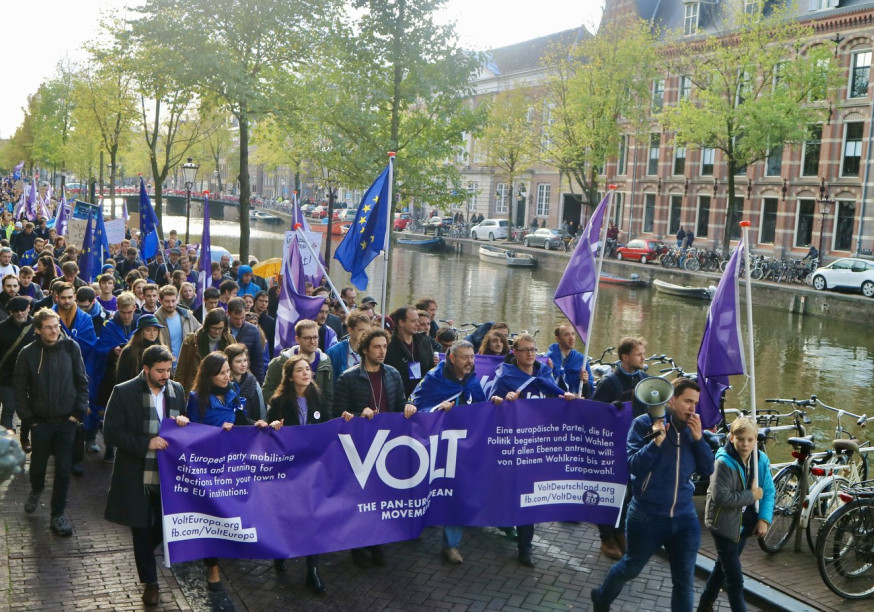 Volt parade in Amsterdam with flag